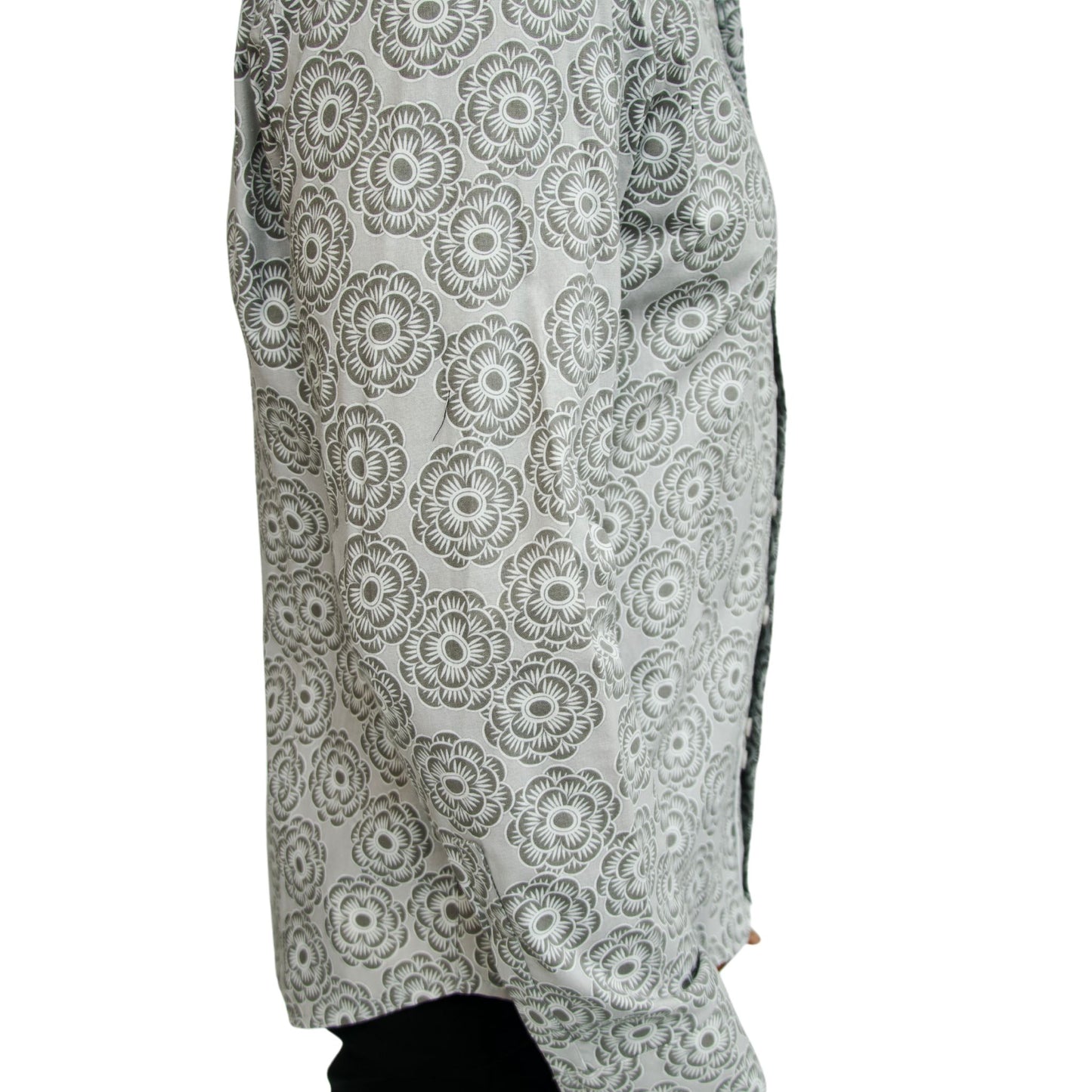 side view of men's white and gray floral button down shirt shown on model