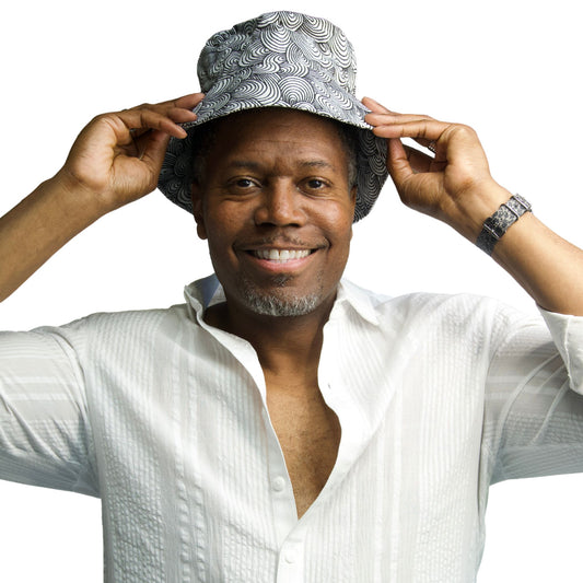 black and white bold swirl pattern bucket hat shown on model