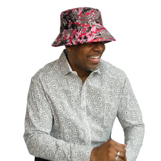 men's white and gray floral button down shirt shown on model also wearing a bright men's bucket hat